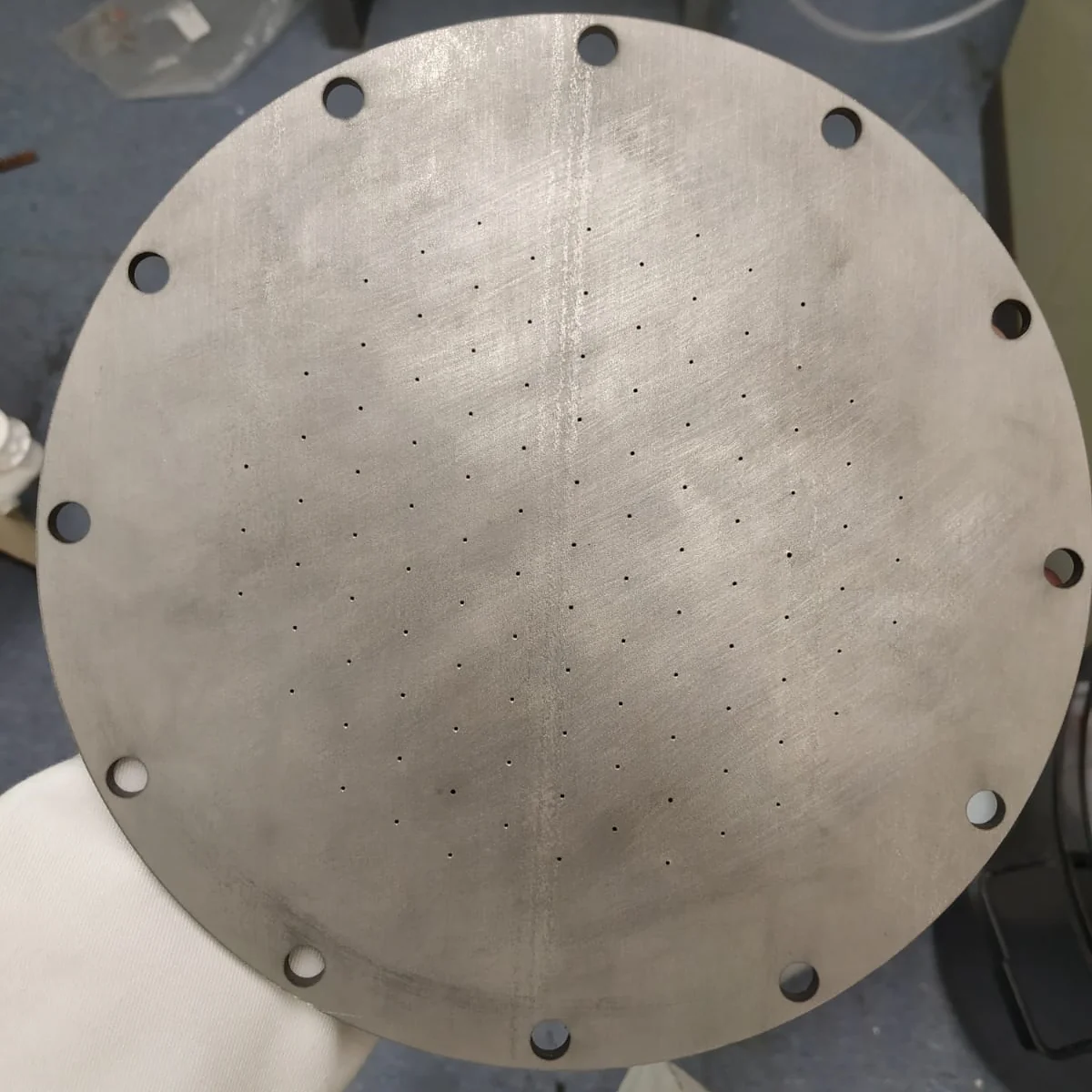 Manufactured full-scale SS316 oxidiser injector featuring 109 precision-drilled orifices